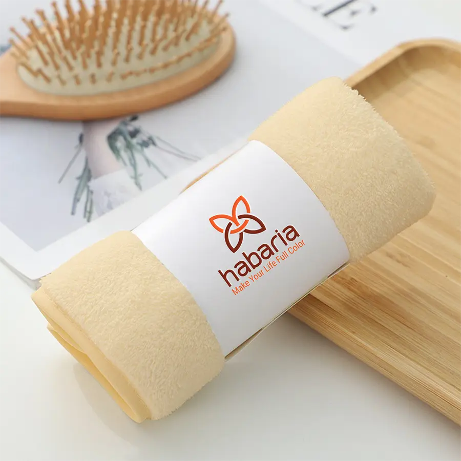 Cosmetic logo design Habaria applied on a product mockup showing brand identity on beauty accessories