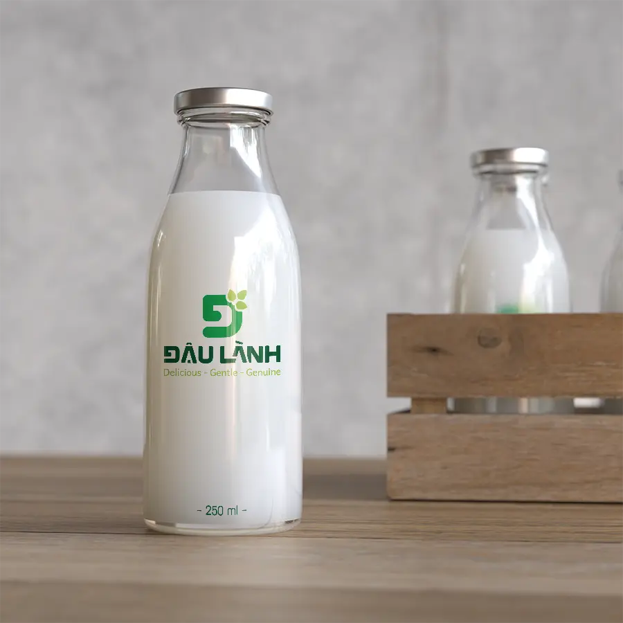 The Đậu Lành logo applied on a glass soy milk bottle as part of the brand’s product packaging