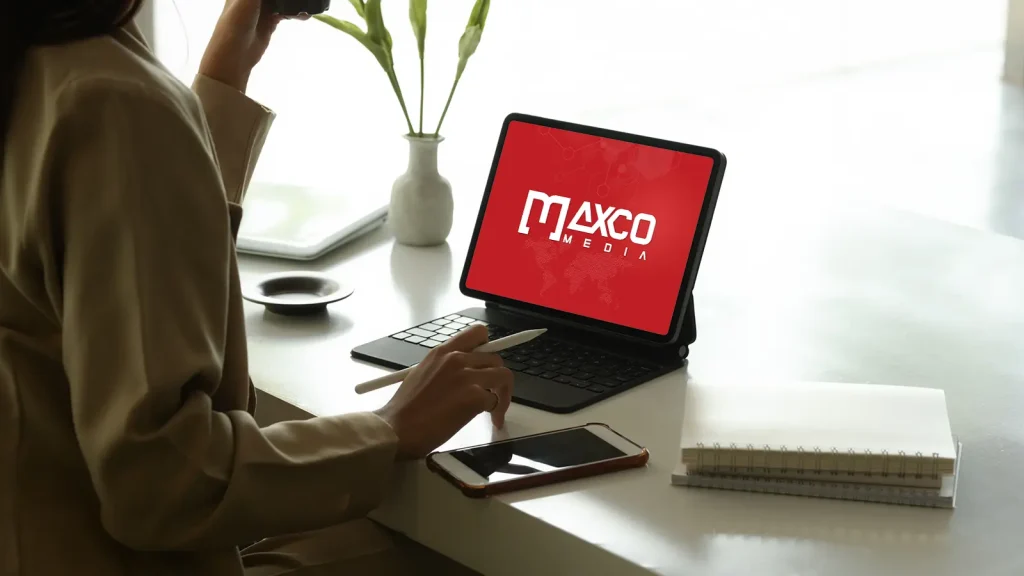 Logo design for media company Maxco Media displayed in a digital working environment