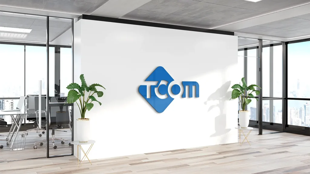 Technology logo design Tcom with blue geometric symbol representing a modern and professional brand identity